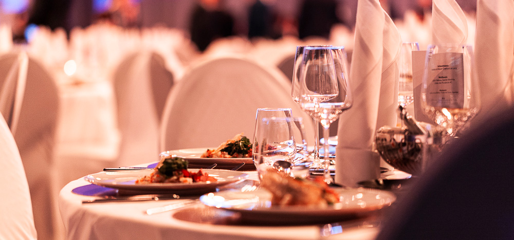 A festively decorated dinner table in a hall